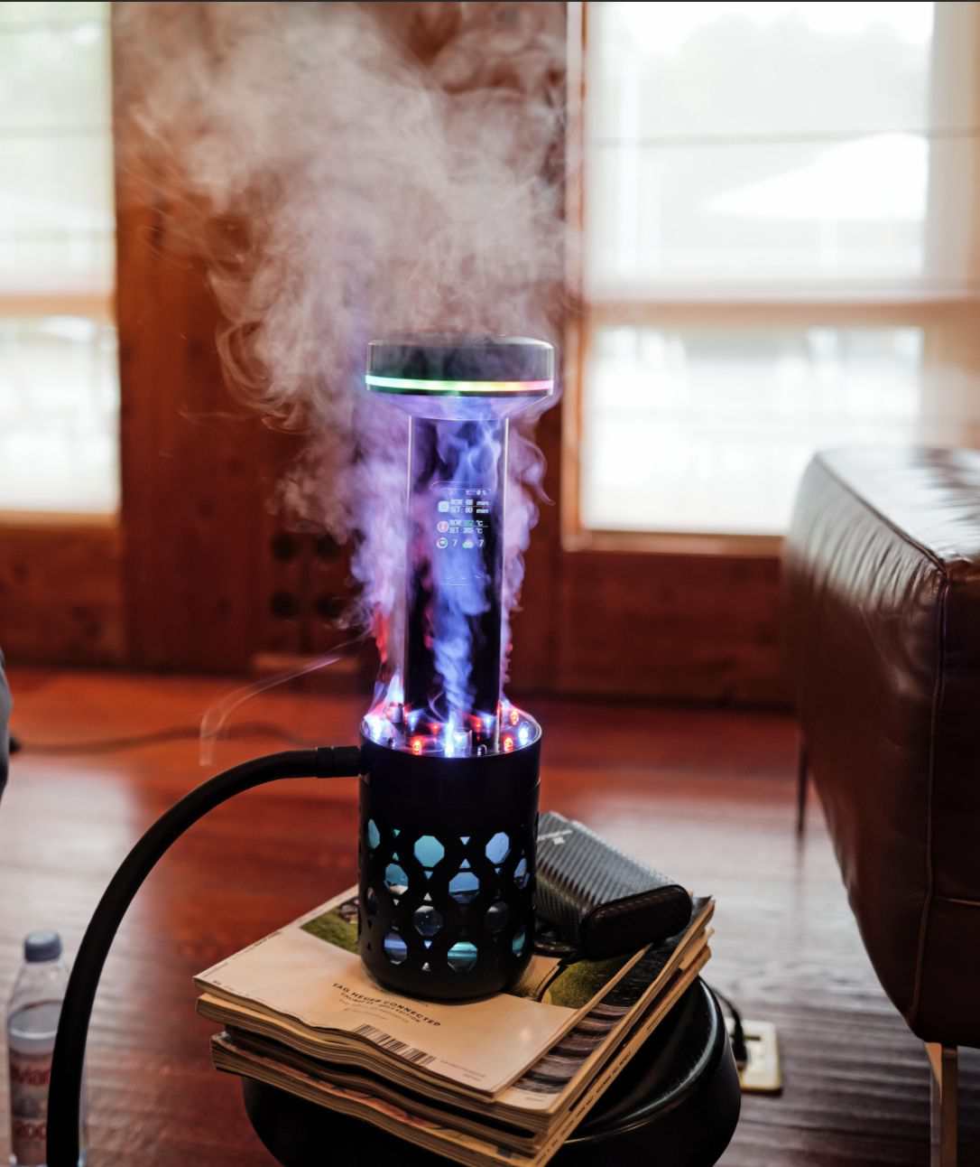 The glowing geometric honeycomb base of the MIRUCEL electronic shisha device.